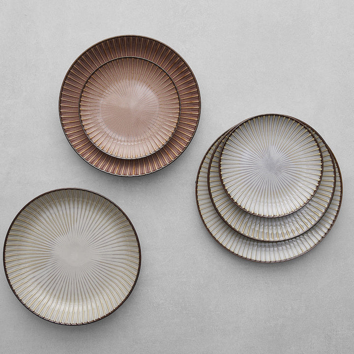 Set of bowls in earthy tones from the Sendan collection, showcasing Mino ware porcelain craftsmanship.