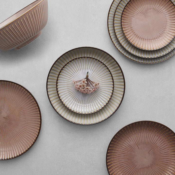 Bowl and plates from the Mino Ware Sendan collection, showcasing earthy glazes and fine porcelain craftsmanship.