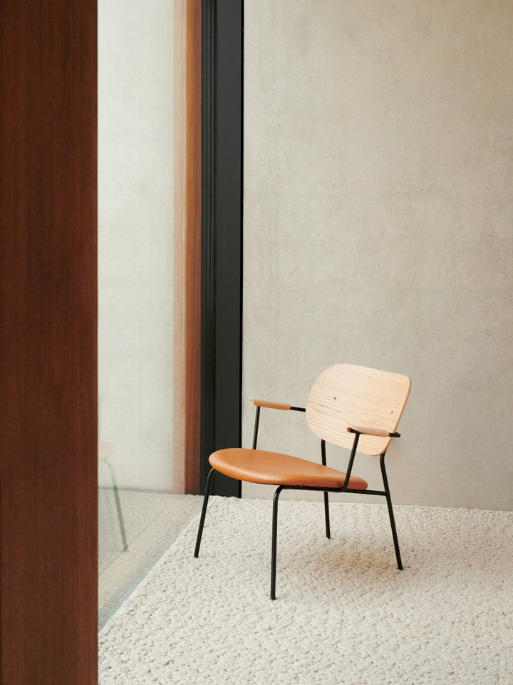 Co Lounge Chair by Audo Copenhagen - Our Co Chair Collection proves that comfort doesn't have to come at the cost of beauty. Equal parts elegance and ease, its graceful minimal, modern frame and supportive, angled backrest make sitting a pleasure — for ho