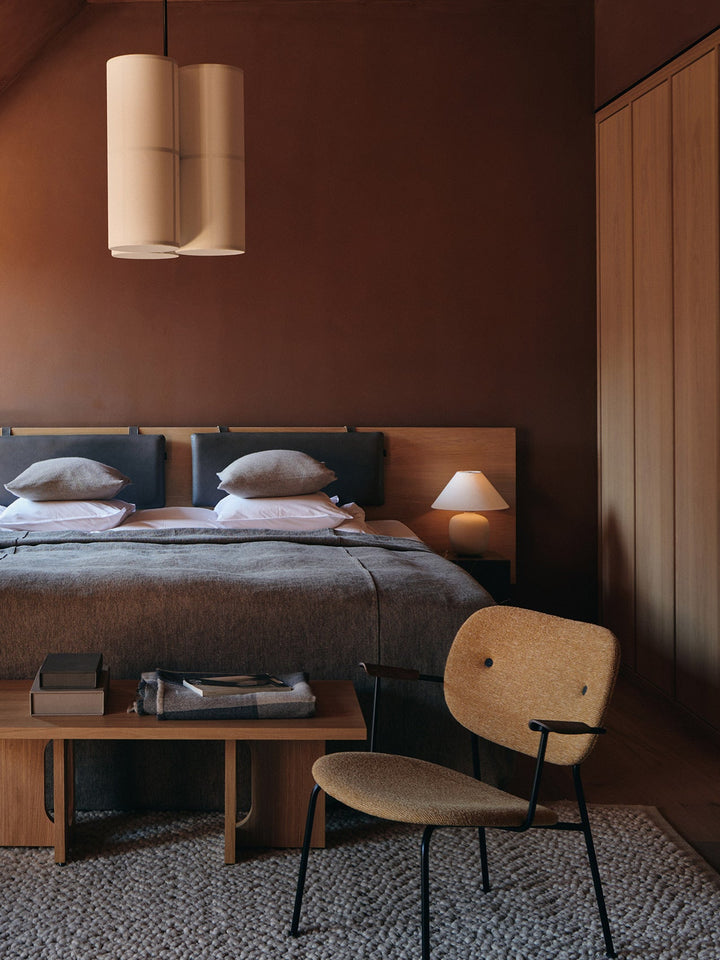 Co Lounge, fully upholstered by Audo Copenhagen - Profiling a more laid-back look than its dining counterparts, the comfortable Co Lounge Chair, designed for Audo by Norm Architects and Els Van Hoorebeeck, features curved armrests and an upholstered seat