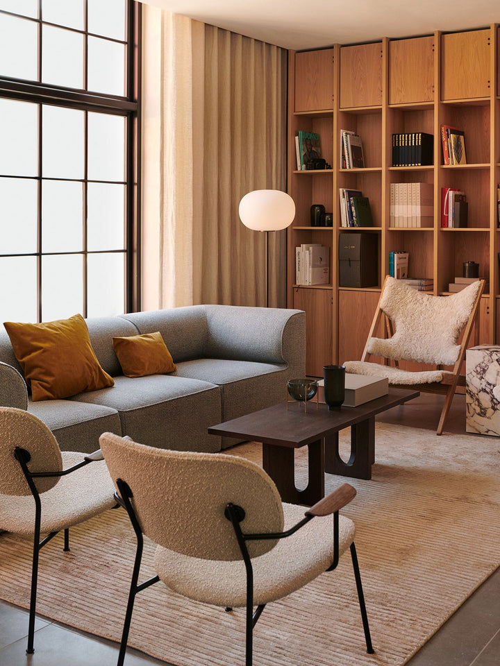 Co Lounge, fully upholstered by Audo Copenhagen - Profiling a more laid-back look than its dining counterparts, the comfortable Co Lounge Chair, designed for Audo by Norm Architects and Els Van Hoorebeeck, features curved armrests and an upholstered seat