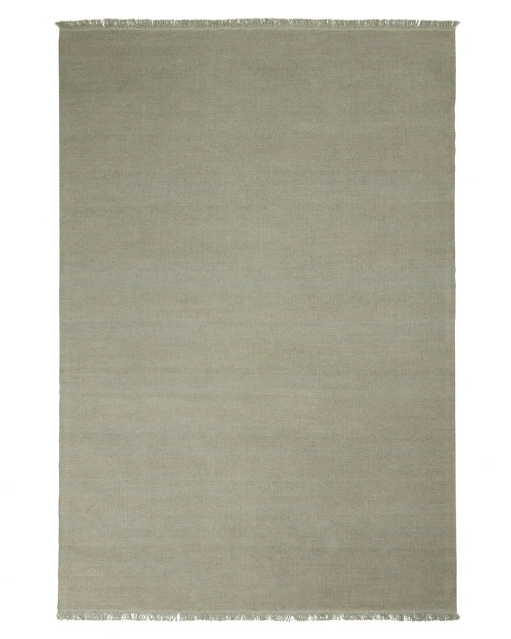 Emilio Flint - Premium Linen Rug for Modern Homes Emilio Flint adds serene sophistication with its grey-blue hue and refined fringe, perfect for contemporary and minimalist spaces.