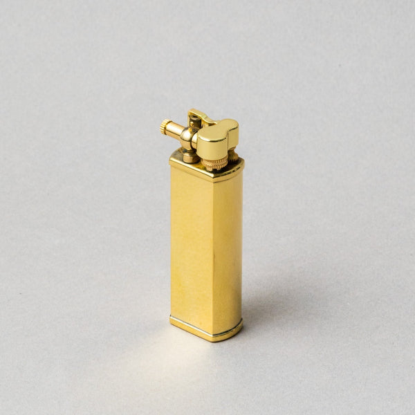 Luxurious Tsubota Pearl Bolbo Gold Lighter, handcrafted in Tokyo, showcasing exceptional metalwork.