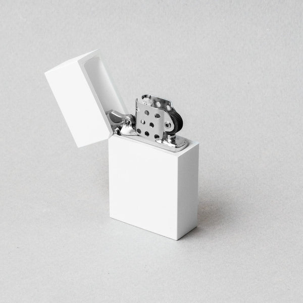 Tsubota Pearl hard edge white lighter with open lid, showcasing premium craftsmanship in Tokyo.