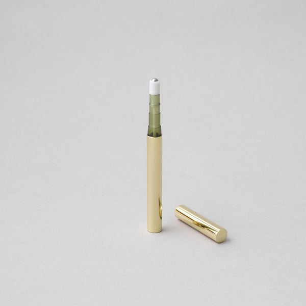 Gold perfume stick roller by Tsubota Pearl, compact and handcrafted in Tokyo, designed for easy fragrance application.