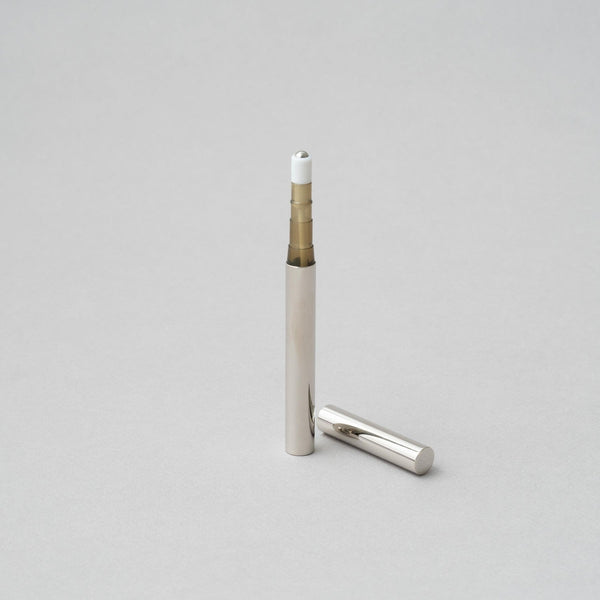 Tsubota Pearl Perfume Stick Roller in nickel finish, portable and handcrafted in Tokyo, measuring 102 x 9 x 9 mm.