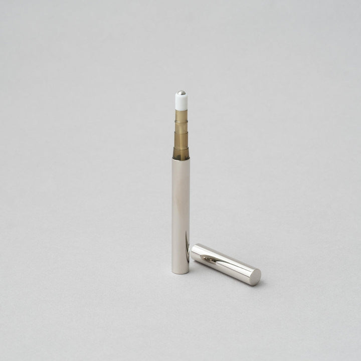 Tsubota Pearl Perfume Stick Roller in nickel finish, portable and handcrafted in Tokyo, measuring 102 x 9 x 9 mm.