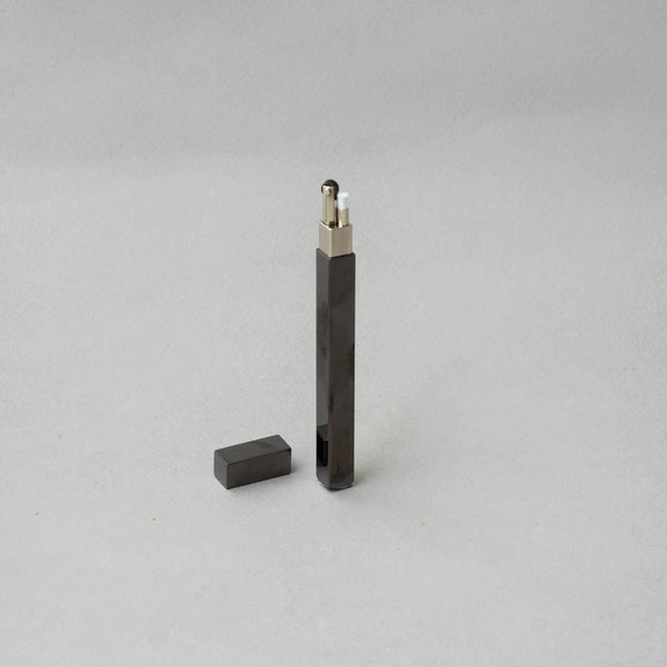 Elegantly designed TSUBOTA PEARL Queue Black Nickel Petrol Lighter, showcasing a sleek black finish and metal craftsmanship.