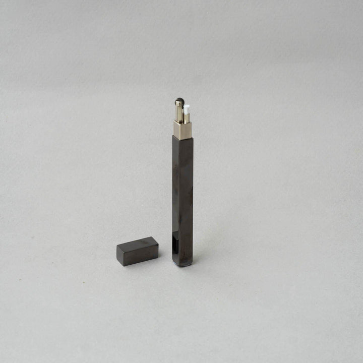 Elegantly designed TSUBOTA PEARL Queue Black Nickel Petrol Lighter, showcasing a sleek black finish and metal craftsmanship.