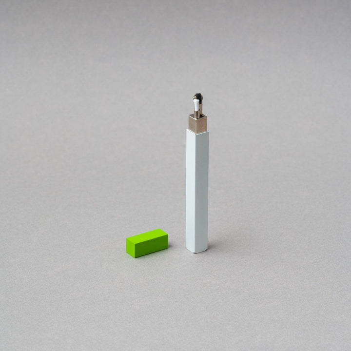 TSUBOTA PEARL Queue Matte White and Green Petrol Lighter with refillable feature on gray background.