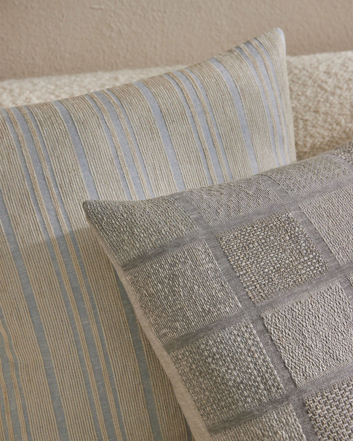 Adriana Glacier A woven mix of lustrous chenille and dry natural fibres gives Adriana a chic finish and luxe feel. A palette that heros modern, essential, on-trend hues. Glacier combines sky blue with a contrasting sandstone stripe.Timeless and classic in