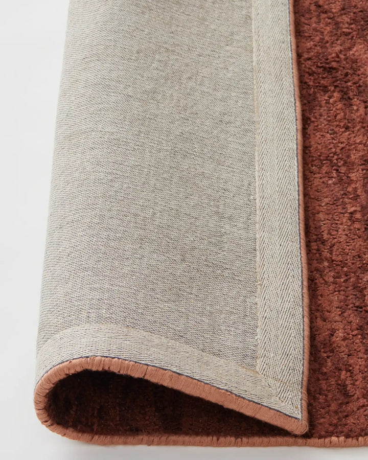 Almonte Clay - Luxurious Hand-Woven Rug Almonte Clay rug offers thickness and softness, ideal for low-traffic areas and crafted from bamboo silk and wool.