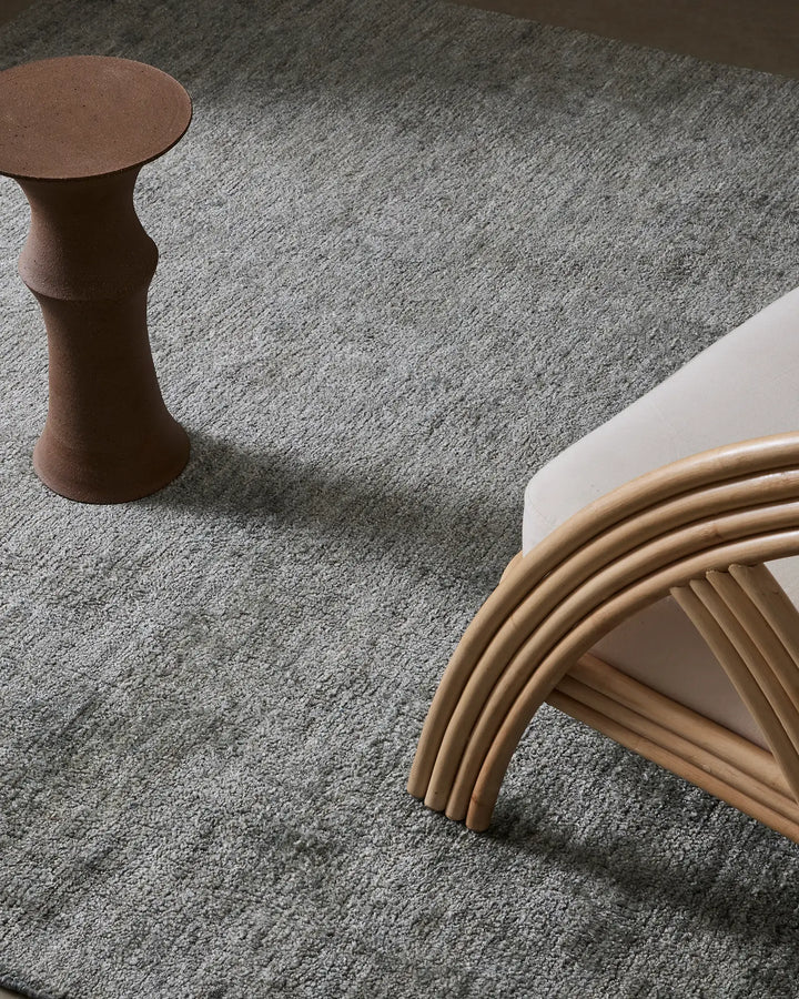 Almonte Pluto - Luxurious Hand-Woven Grey Rug Discover the Almonte Pluto, a soft and thick rug perfect for low-traffic areas, featuring bamboo silk and elegant shades of blue.