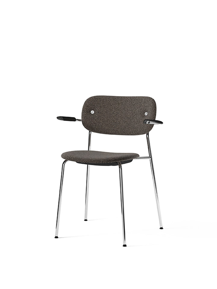 Co Dining Chair, fully upholstered with armrest, Chrome by Audo Copenhagen - The Co Chair Collection pairs a lightweight, sleek profile with great seating comfort. Available with or without armrests in three wood versions, the versatile design of the full