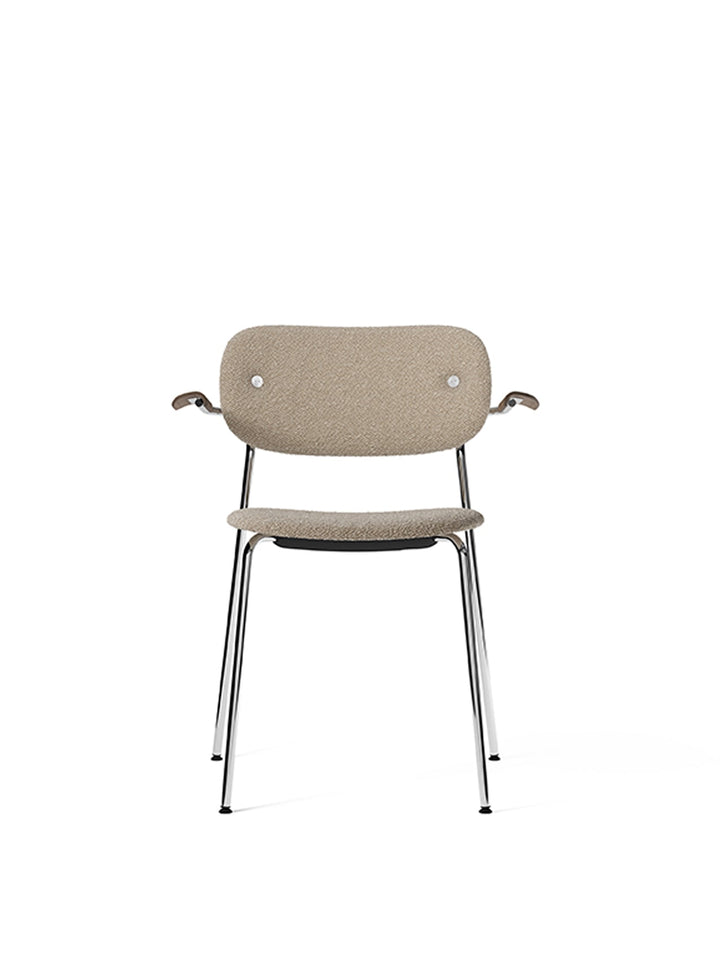 Co Dining Chair, fully upholstered with armrest, Chrome by Audo Copenhagen - The Co Chair Collection pairs a lightweight, sleek profile with great seating comfort. Available with or without armrests in three wood versions, the versatile design of the full