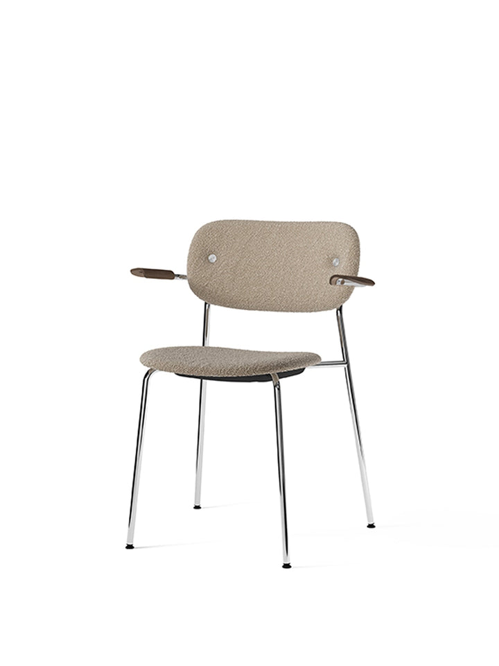 Co Dining Chair, fully upholstered with armrest, Chrome by Audo Copenhagen - The Co Chair Collection pairs a lightweight, sleek profile with great seating comfort. Available with or without armrests in three wood versions, the versatile design of the full