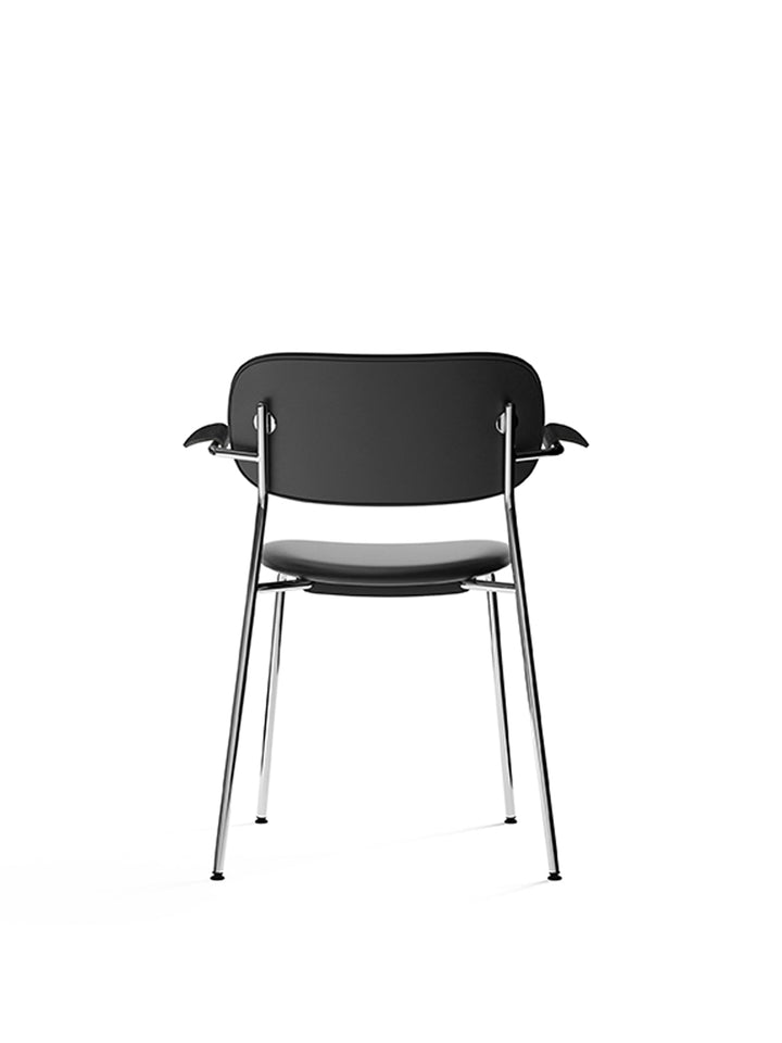 Co Dining Chair, fully upholstered with armrest, Chrome by Audo Copenhagen - The Co Chair Collection pairs a lightweight, sleek profile with great seating comfort. Available with or without armrests in three wood versions, the versatile design of the full