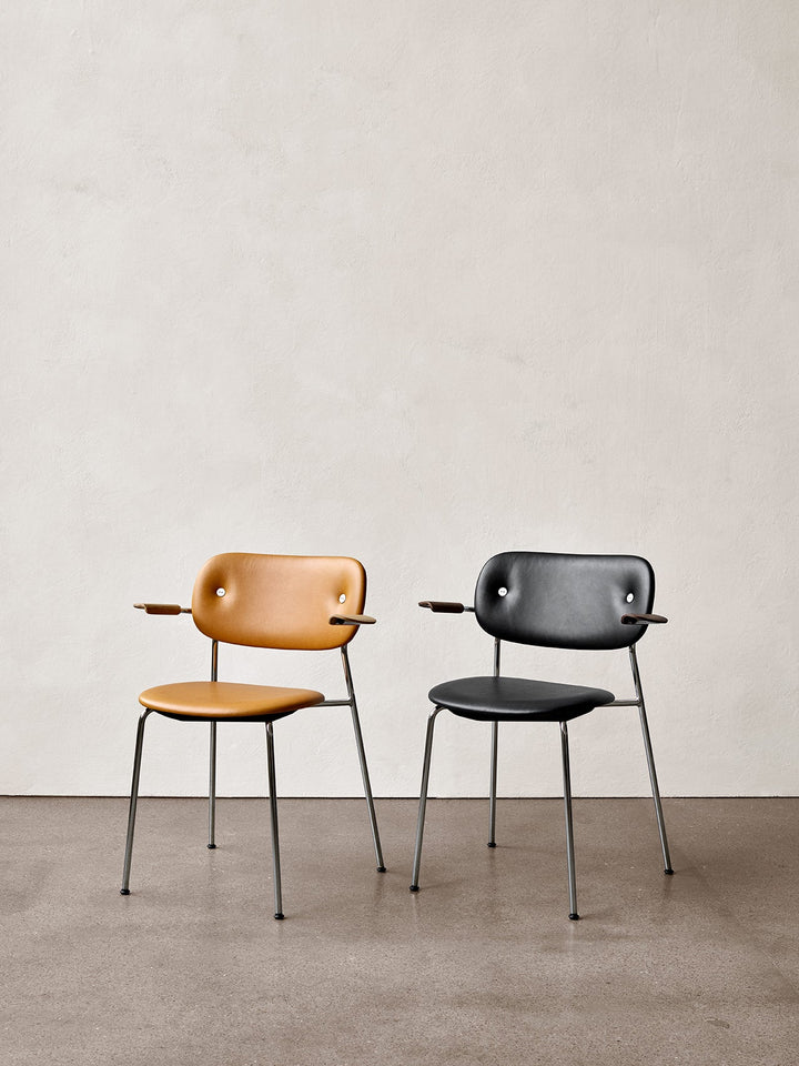Co Dining Chair, fully upholstered with armrest, Chrome by Audo Copenhagen - The Co Chair Collection pairs a lightweight, sleek profile with great seating comfort. Available with or without armrests in three wood versions, the versatile design of the full