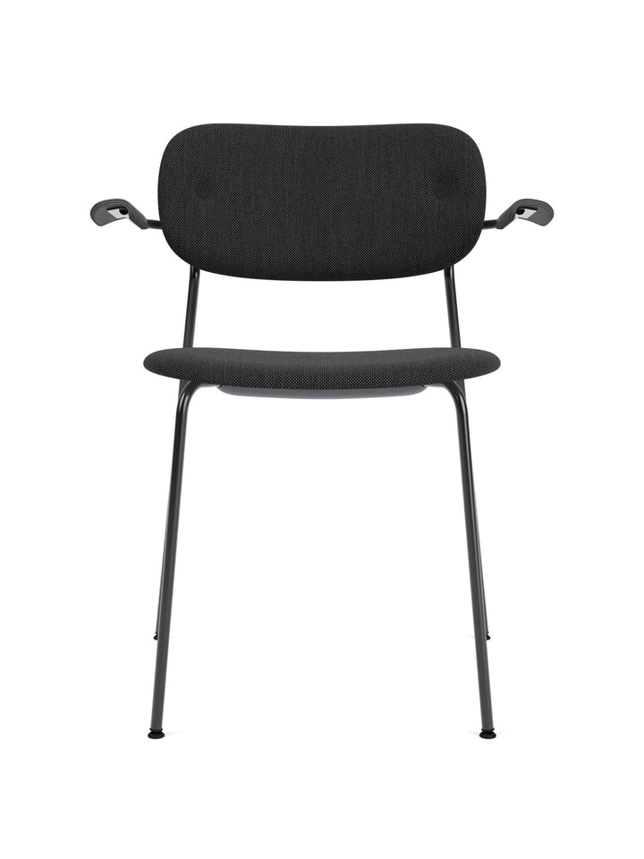 Co Dining Chair, fully upholstered with armrest, Black by Audo Copenhagen - The Co Chair Collection pairs a lightweight, sleek profile with great seating comfort. Available with or without armrests in three wood versions, the versatile design of the fully