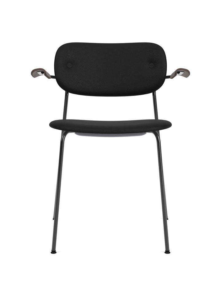 Co Dining Chair, fully upholstered with armrest, Black by Audo Copenhagen - The Co Chair Collection pairs a lightweight, sleek profile with great seating comfort. Available with or without armrests in three wood versions, the versatile design of the fully