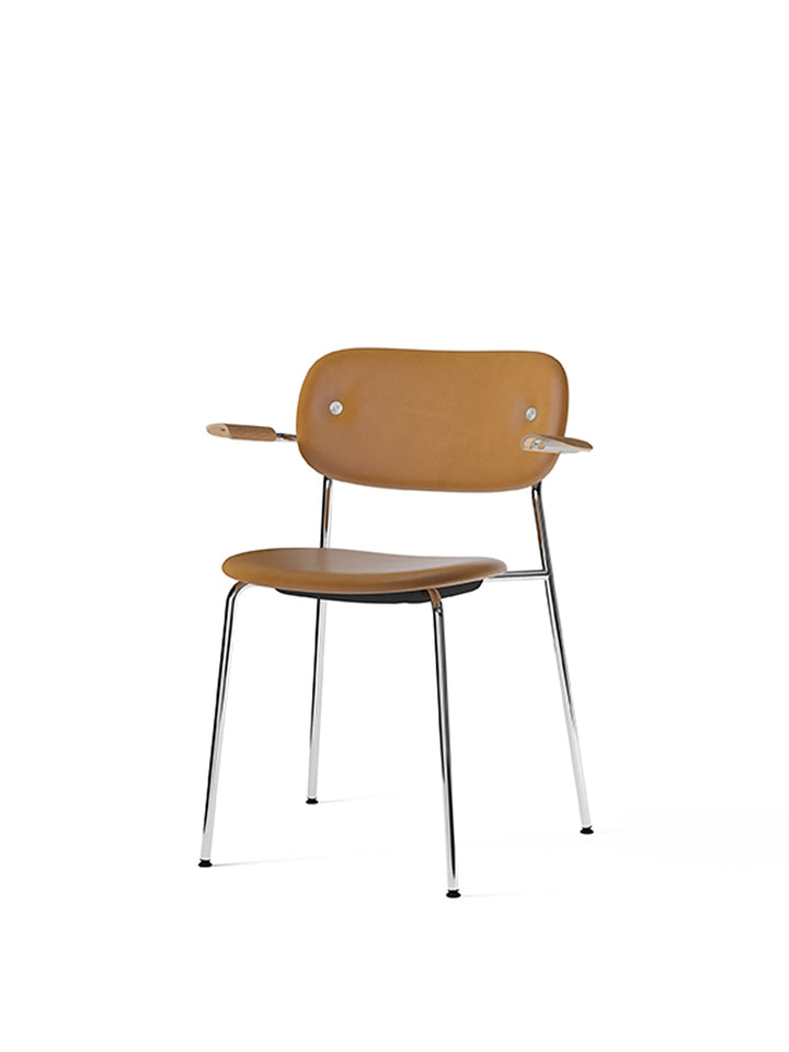 Co Dining Chair, fully upholstered with armrest, Chrome by Audo Copenhagen - The Co Chair Collection pairs a lightweight, sleek profile with great seating comfort. Available with or without armrests in three wood versions, the versatile design of the full