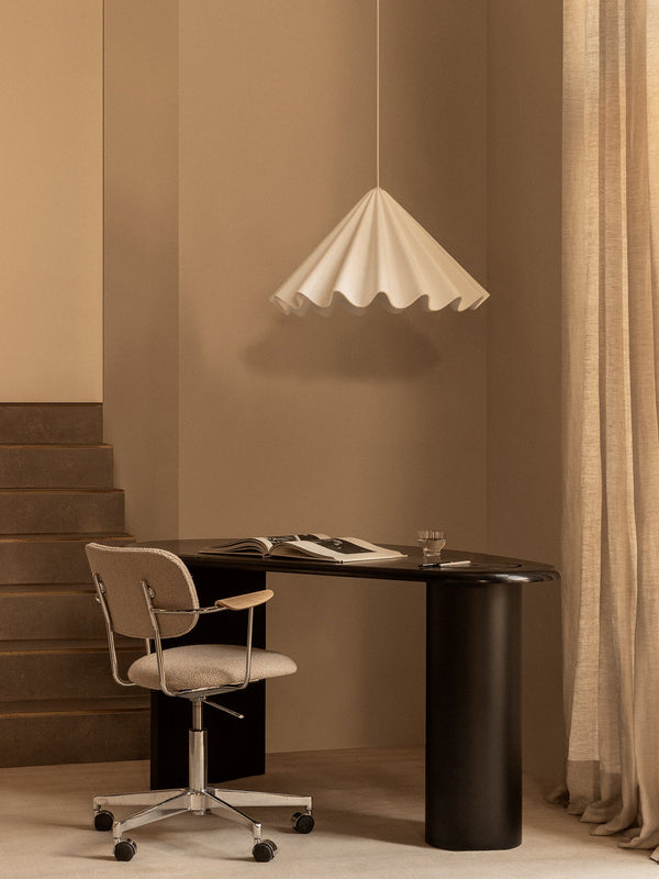 Audo CPH The Eclipse Desk by Audo Copenhagen - The Eclipse Desk showcases a striking blend of elements and layout. Its unique curved shape, reminiscent of the celestial bodies, is appealing to the senses. Available in black-lacquered or oiled natural oak,