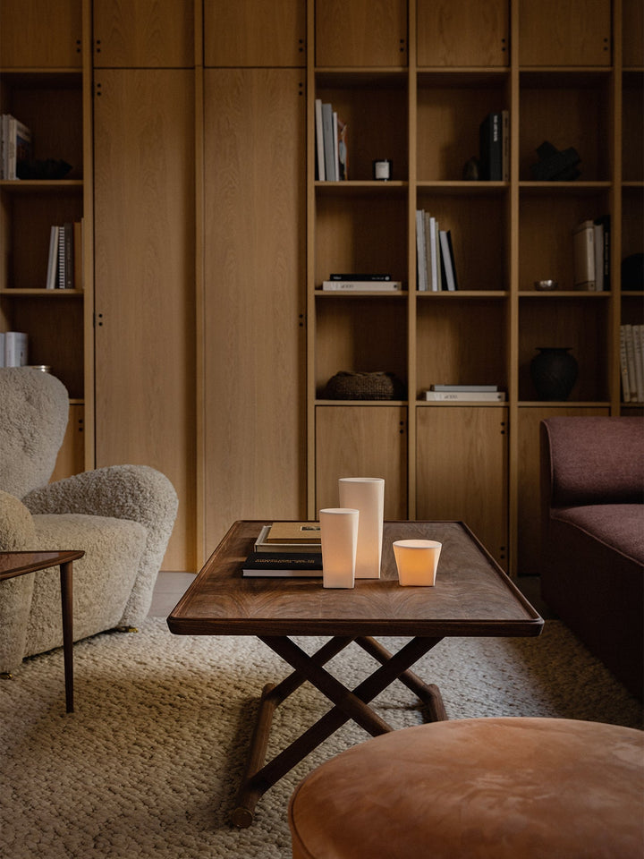 Audo Jäger Lounge Table by Audo Copenhagen - The Jäger Lounge Table by Mogens Lassen, an archival design from 1941, combines traditional craftsmanship with functional design. Made with oiled oak or walnut wood and brass details, this foldable table is ins