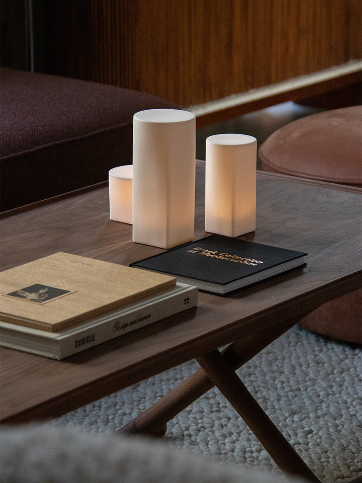 Audo Jäger Lounge Table by Audo Copenhagen - The Jäger Lounge Table by Mogens Lassen, an archival design from 1941, combines traditional craftsmanship with functional design. Made with oiled oak or walnut wood and brass details, this foldable table is ins