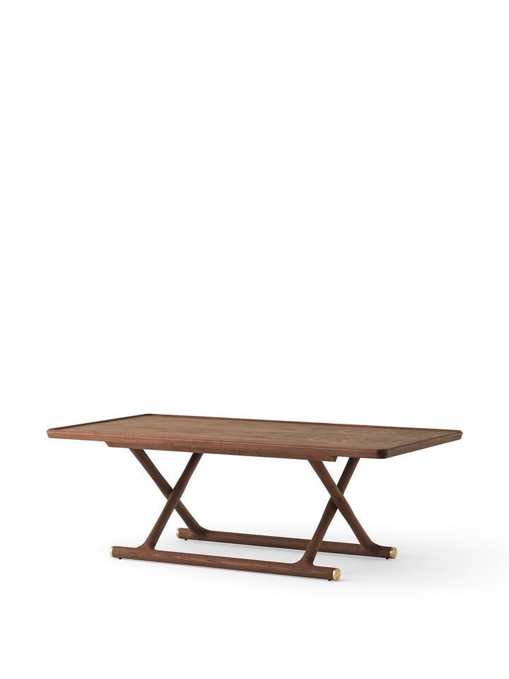 Audo Jäger Lounge Table by Audo Copenhagen - The Jäger Lounge Table by Mogens Lassen, an archival design from 1941, combines traditional craftsmanship with functional design. Made with oiled oak or walnut wood and brass details, this foldable table is ins