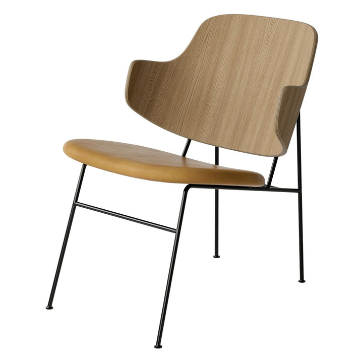 The Penguin Timber Lounge Chair by Audo Copenhagen - The Penguin Lounge Chair is a mid-century masterpiece. Reclining and harmonious, but with plenty of boldness, it is characterised by calmness and balance. Sitting in this deep, low chair feels comfortab