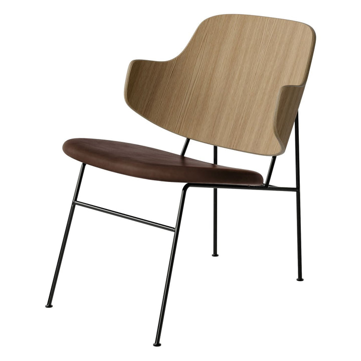 The Penguin Timber Lounge Chair by Audo Copenhagen - The Penguin Lounge Chair is a mid-century masterpiece. Reclining and harmonious, but with plenty of boldness, it is characterised by calmness and balance. Sitting in this deep, low chair feels comfortab