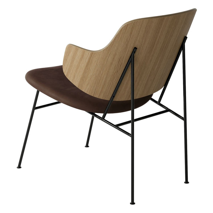 The Penguin Timber Lounge Chair by Audo Copenhagen - The Penguin Lounge Chair is a mid-century masterpiece. Reclining and harmonious, but with plenty of boldness, it is characterised by calmness and balance. Sitting in this deep, low chair feels comfortab