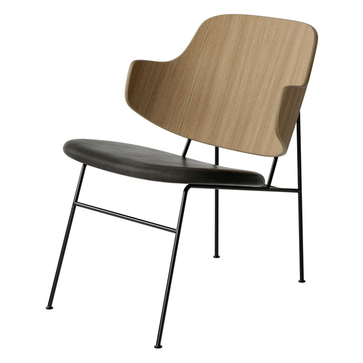 The Penguin Timber Lounge Chair by Audo Copenhagen - The Penguin Lounge Chair is a mid-century masterpiece. Reclining and harmonious, but with plenty of boldness, it is characterised by calmness and balance. Sitting in this deep, low chair feels comfortab