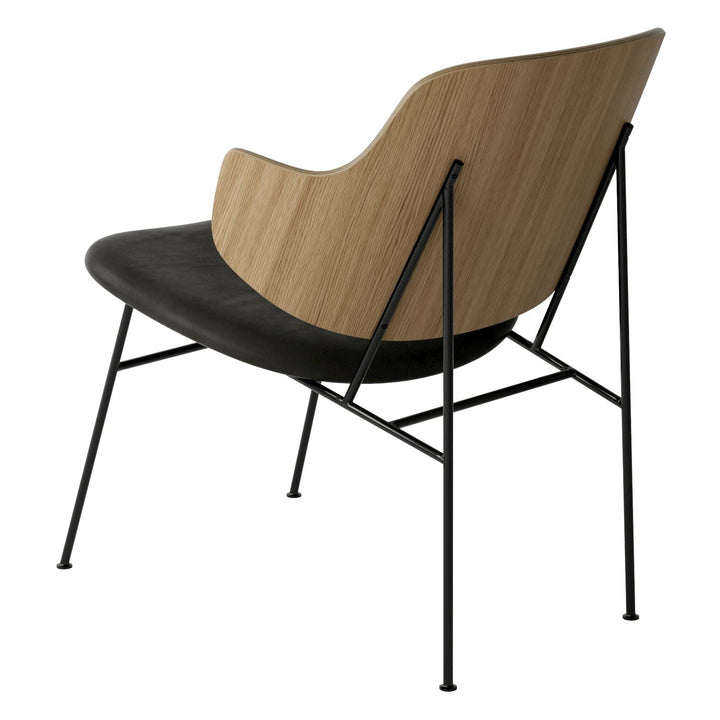 The Penguin Timber Lounge Chair by Audo Copenhagen - The Penguin Lounge Chair is a mid-century masterpiece. Reclining and harmonious, but with plenty of boldness, it is characterised by calmness and balance. Sitting in this deep, low chair feels comfortab