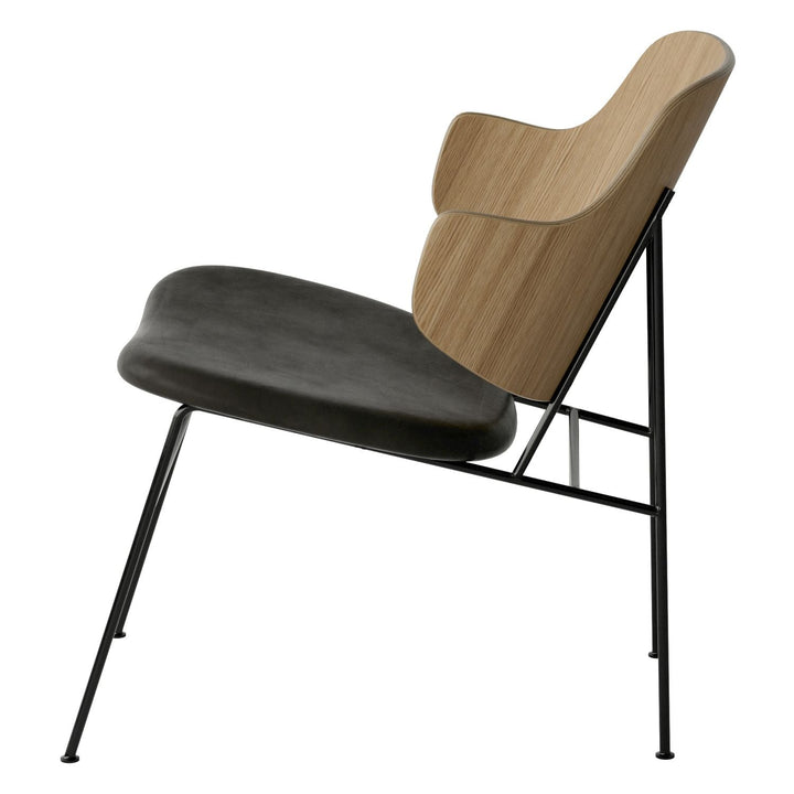 The Penguin Timber Lounge Chair by Audo Copenhagen - The Penguin Lounge Chair is a mid-century masterpiece. Reclining and harmonious, but with plenty of boldness, it is characterised by calmness and balance. Sitting in this deep, low chair feels comfortab