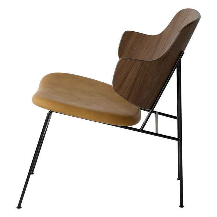 The Penguin Timber Lounge Chair by Audo Copenhagen - The Penguin Lounge Chair is a mid-century masterpiece. Reclining and harmonious, but with plenty of boldness, it is characterised by calmness and balance. Sitting in this deep, low chair feels comfortab