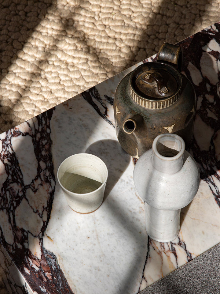 Plinth Low by Audo Copenhagen - The Plinth Low is a stunning addition to the Plinth Collection, featuring natural materials and expert craftsmanship. Its elegant design brings warmth and texture to any space. Available in a variety of marble options, incl