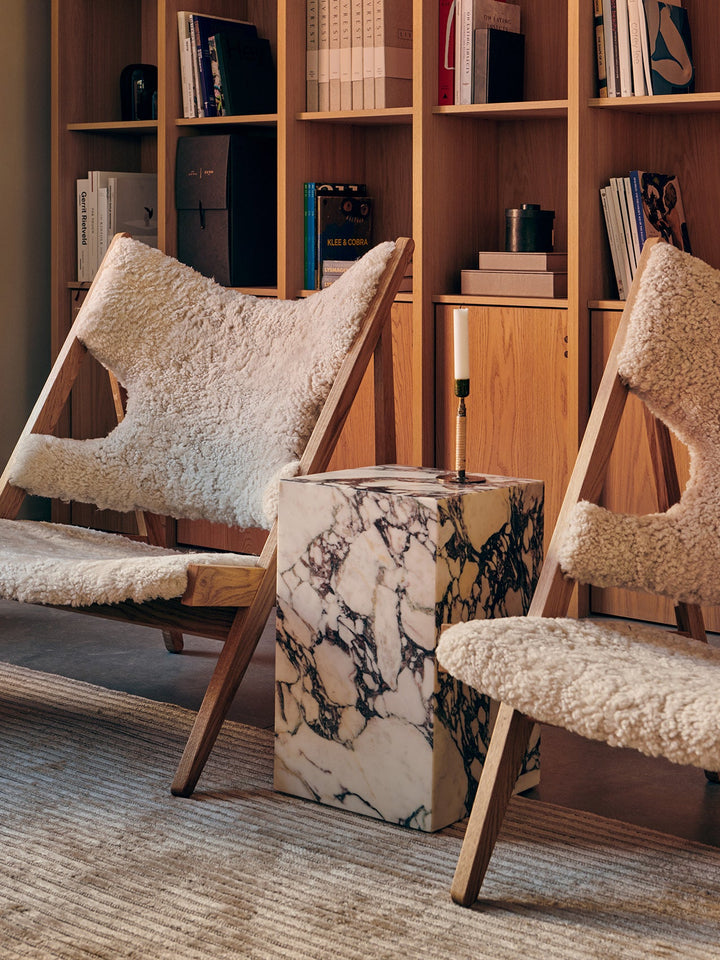 Plinth Tall by Audo Copenhagen - The Plinth Tall from the Plinth Collection boasts supreme craftsmanship and natural materials, including Calacatta Viola, Grey Kendzo, Nero Marquina, and White Carrera marble. With a symmetrical design, it serves as both a