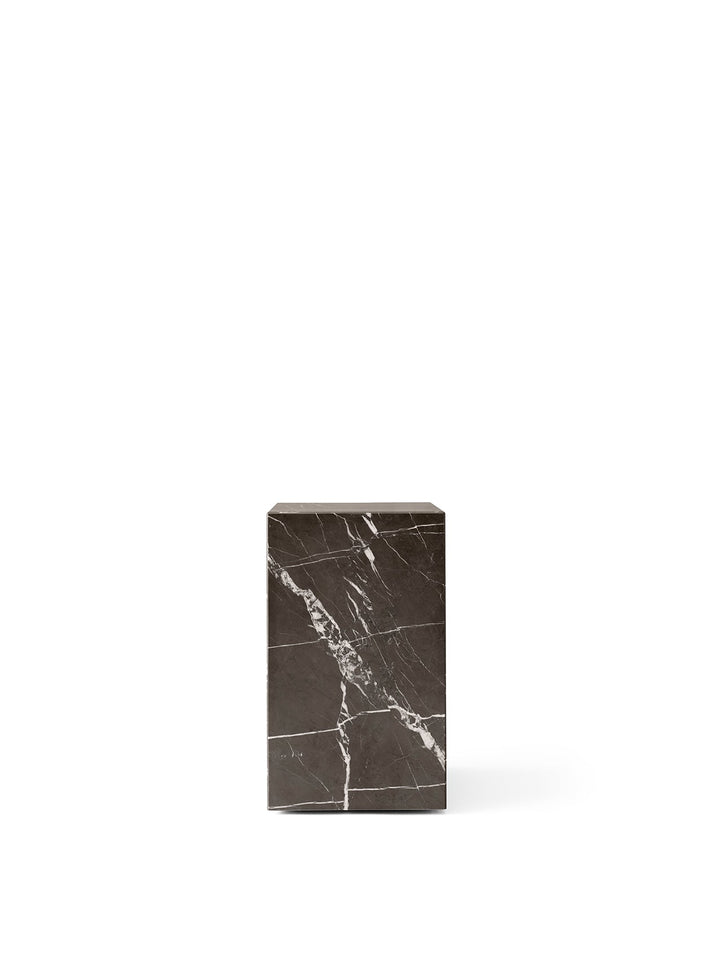Plinth Tall by Audo Copenhagen - The Plinth Tall from the Plinth Collection boasts supreme craftsmanship and natural materials, including Calacatta Viola, Grey Kendzo, Nero Marquina, and White Carrera marble. With a symmetrical design, it serves as both a