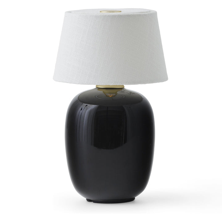 Torso Portable Table Lamp by Audo Copenhagen - The Torso Portable Table Lamp by Krøyer-Sætter-Lassen is a miniature version of their popular full-size design of the same name, which takes its design cues from childhood homes filled with treasures shaped b