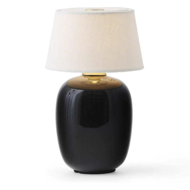 Torso Portable Table Lamp by Audo Copenhagen - The Torso Portable Table Lamp by Krøyer-Sætter-Lassen is a miniature version of their popular full-size design of the same name, which takes its design cues from childhood homes filled with treasures shaped b
