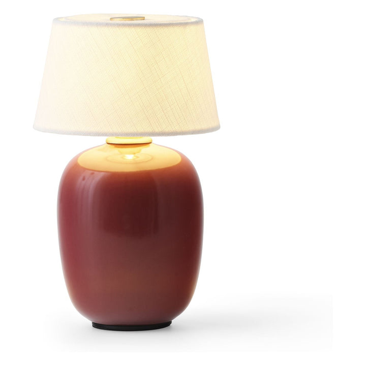Torso Portable Table Lamp by Audo Copenhagen - The Torso Portable Table Lamp by Krøyer-Sætter-Lassen is a miniature version of their popular full-size design of the same name, which takes its design cues from childhood homes filled with treasures shaped b