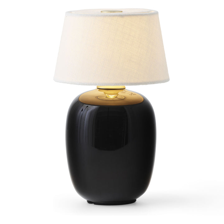 Torso Portable Table Lamp by Audo Copenhagen - The Torso Portable Table Lamp by Krøyer-Sætter-Lassen is a miniature version of their popular full-size design of the same name, which takes its design cues from childhood homes filled with treasures shaped b