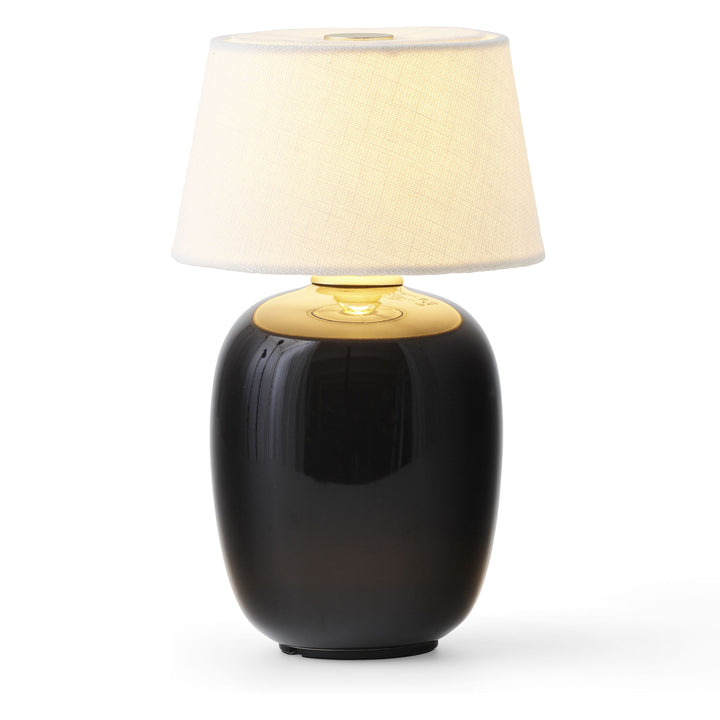 Torso Portable Table Lamp by Audo Copenhagen - The Torso Portable Table Lamp by Krøyer-Sætter-Lassen is a miniature version of their popular full-size design of the same name, which takes its design cues from childhood homes filled with treasures shaped b