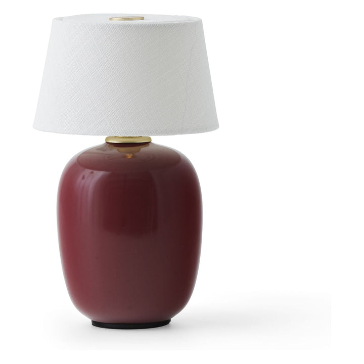Torso Portable Table Lamp by Audo Copenhagen - The Torso Portable Table Lamp by Krøyer-Sætter-Lassen is a miniature version of their popular full-size design of the same name, which takes its design cues from childhood homes filled with treasures shaped b