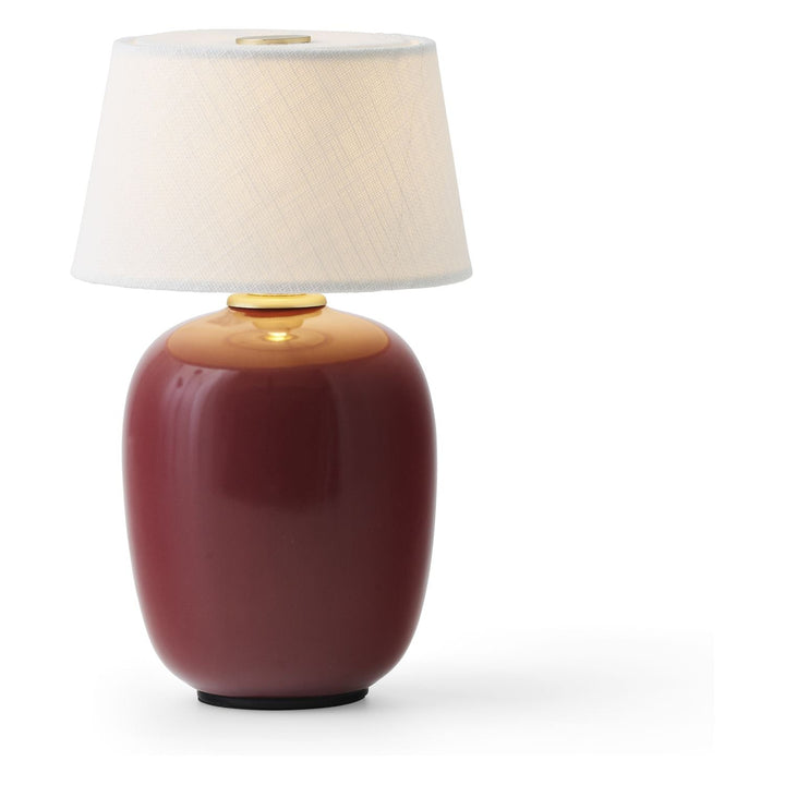 Torso Portable Table Lamp by Audo Copenhagen - The Torso Portable Table Lamp by Krøyer-Sætter-Lassen is a miniature version of their popular full-size design of the same name, which takes its design cues from childhood homes filled with treasures shaped b