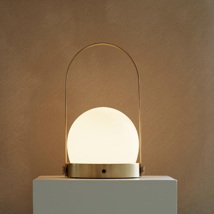AUDO CPH (ex MENU) Carrie Lamp Portable + Rechargeable, Brushed Brass by Audo Copenhagen - The new “Carrie” LED Lamp by Norm Architects is versatile, fully portable and re-chargeable. In Denmark, where winters are cold and long, creating a warm, cozy atmo
