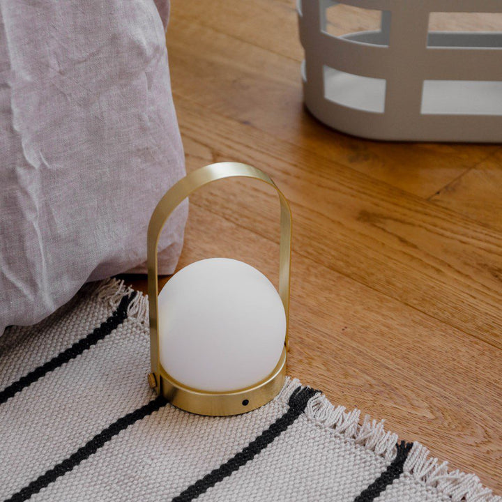 AUDO CPH (ex MENU) Carrie Lamp Portable + Rechargeable, Brushed Brass by Audo Copenhagen - The new “Carrie” LED Lamp by Norm Architects is versatile, fully portable and re-chargeable. In Denmark, where winters are cold and long, creating a warm, cozy atmo