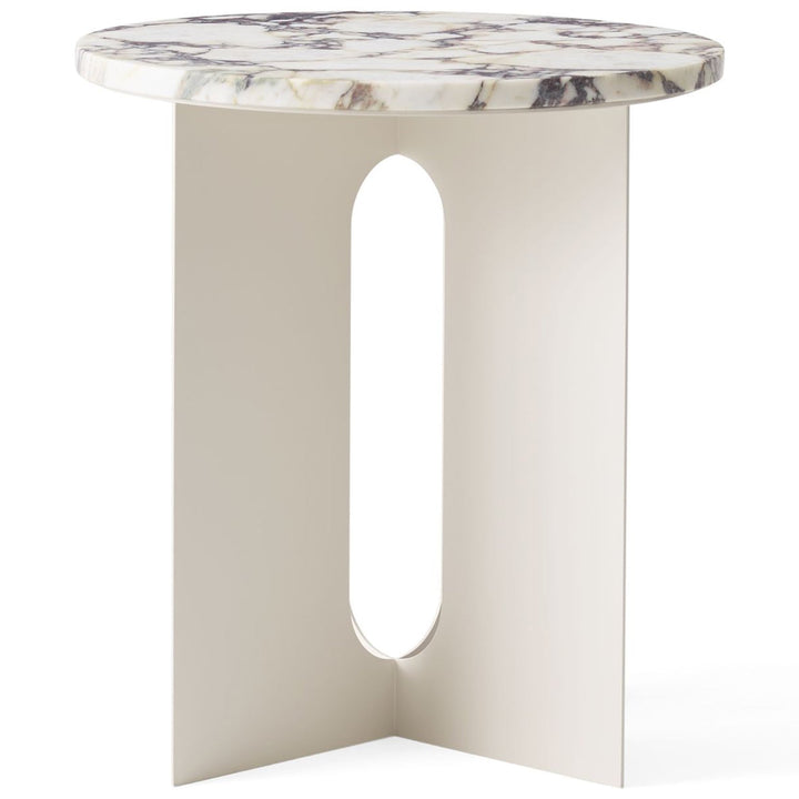 Androgyne Metal Side Table by Audo Copenhagen - The perfectly proportioned table comprises a sturdy powder coated steel base on which a rounded marble tabletop is balanced. The table’s refined marble top, which barely hangs over the legs to create an over