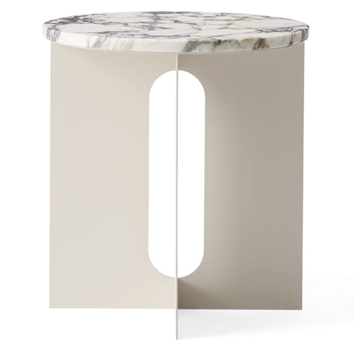 Androgyne Metal Side Table by Audo Copenhagen - The perfectly proportioned table comprises a sturdy powder coated steel base on which a rounded marble tabletop is balanced. The table’s refined marble top, which barely hangs over the legs to create an over